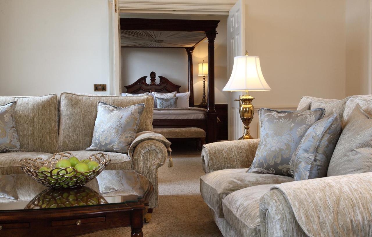 a living room with two couches and a table at Macdonald Bath Spa Hotel in Bath