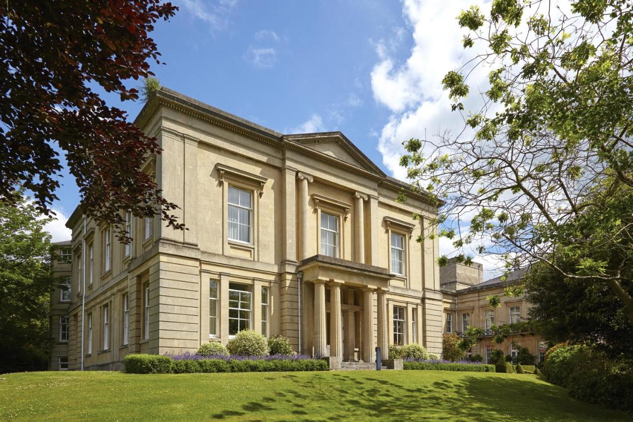 a large building with a grassy yard in front of it at Macdonald Bath Spa Hotel in Bath